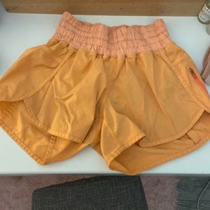Orange lululemon tracker shorts